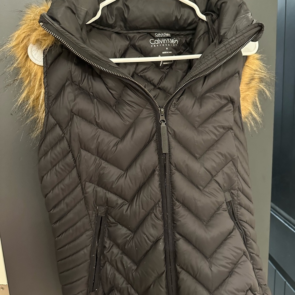 Calvin Klein black vest with feathered hood